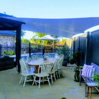 This waterproof sail was designed to extend the customers covered outdoor area, allowing them to entertain rain, hail or shine!