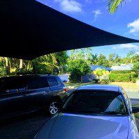 This shade sail was designed to cover the customers driveway to protect their vehicles from the harsh elements.